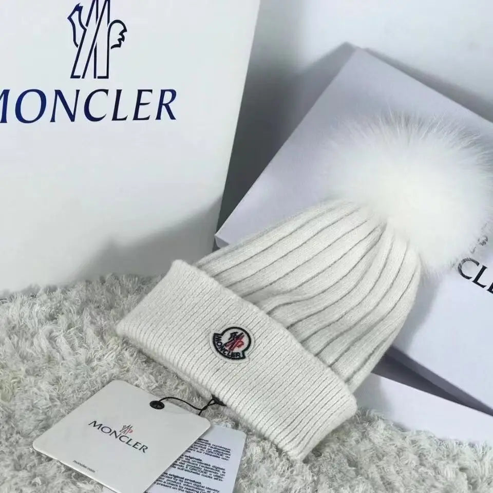 Moncler wollen muts met pompon