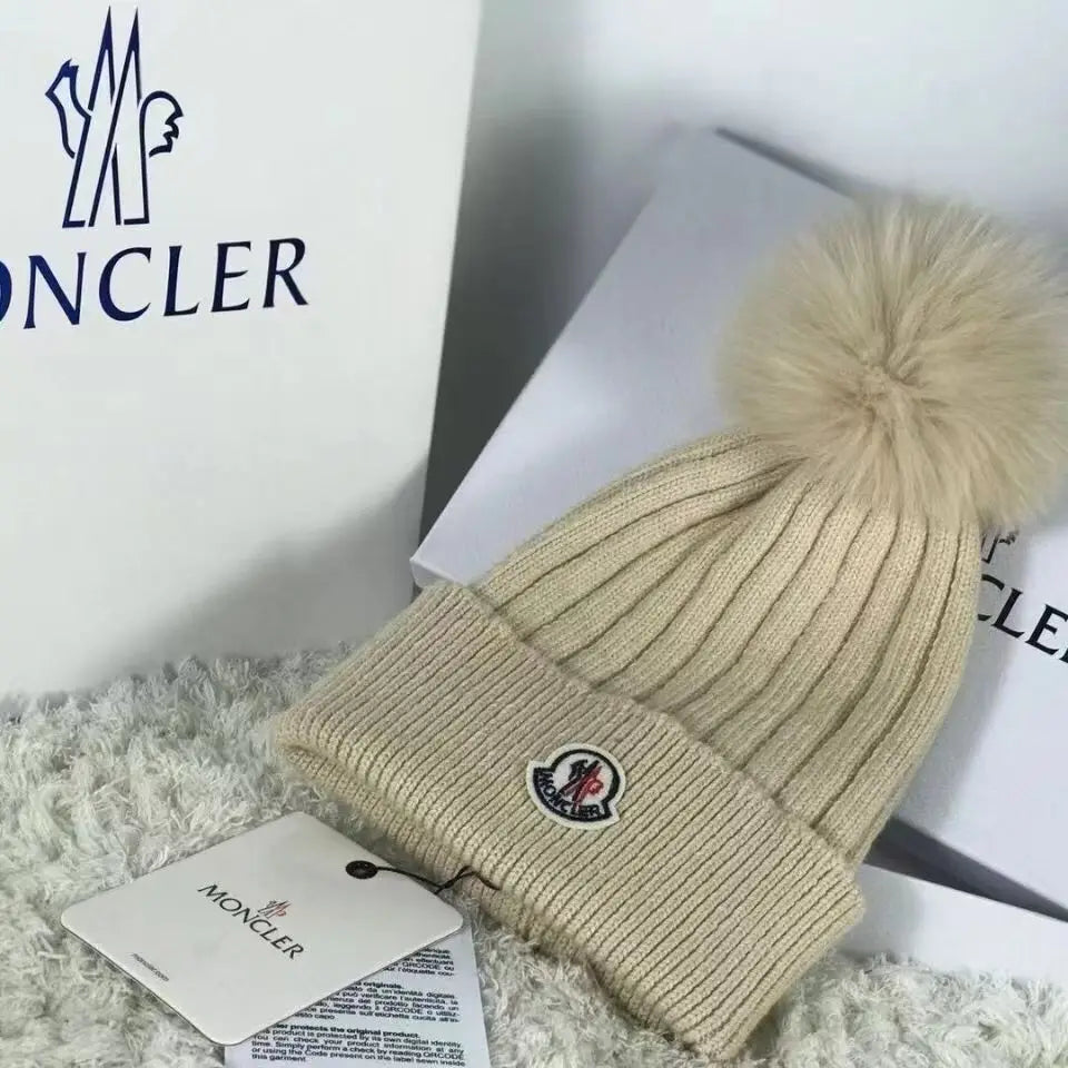 Moncler wollen muts met pompon